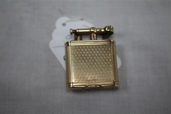 A late 1920s engine turned 9ct gold Dunhill Unique petrol lighter, 1.75in.